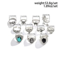 Set of 10 vintage punk rings featuring green turquoise, dragon, and gothic motifs - Vintage Punk Style (04258) / Antique Silver