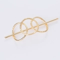 Spilla per capelli minimalista dorata con cerchi geometrici cavi e finitura in metallo martellato - Oro