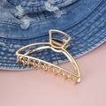 Molla per capelli in metallo dorato a doppio strato con design curvo su denim blu - Oro