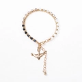 Detail of beaded bracelet with gold arrow charm, faceted multi-color beads, and lobster clasp - Multicolor Beads with Anchor Charm