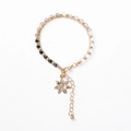 Multilayer beaded bracelet with faceted crystals and a sparkling gold flower pendant - Multicolor Beads with Rhinestone Flower Charm