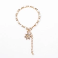 Close-up of double-layer beaded bracelet featuring a gold flower pendant with crystals - Gray White Beads with Flower Charm