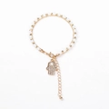 Double-layer crystal beaded bracelet featuring a Hamsa Hand pendant with pavé crystals - Creamy White Beads with Hamsa Hand