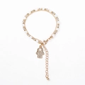 Detail of beaded Hamsa hand bracelet with sparkling rhinestones and pearl accents - Gray White Beads with Hamsa Hand