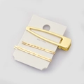 Dettaglio del set di 3 fermagli per capelli in metallo dorato su cartoncino bianco - Becco D'Anatra Traforato E Forcina Ondulata (6)