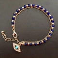 Zweilagiges Goldarmband mit Evil Eye Anhänger und blauen Kristallglasperlen für Damen - Blau