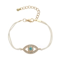 Detail of blue evil eye charm bracelet with clear crystals and adjustable cream woven cord - White Wax Rope