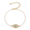 Minimalist gold evil eye bracelet with blue crystal and pave rhinestones on white background - Chain Style