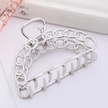 Detailed macro shot of silver hollow chain metal hair claw clip with polished surface - Silver