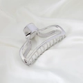 Polished silver metal hollow arc hair claw clip on elegant white silk background - Silver