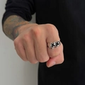 Close-up of hip-hop silver ring with double black pentagram star design on finger - Inner Diameter 1.8cm (Adjustable) / Silver Tone with Black Star (00922)