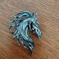 Exquisite horse head brooch in gun black finish on dark wood background - Gunmetal