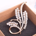 Macro view of gold crystal flower brooch on a black sponge inside a craft box - Gold