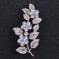 Macro detail of leaf brooch with gold plating and sparkling iridescent crystal rhinestones - Gold Floral (c-100)