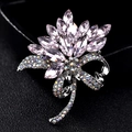 Elegant floral crystal brooch with pink marquise rhinestones on a black velvet background - Pink Orchid