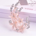 Pink opal flower brooch with crystal rhinestones and rose gold petals on a display box - Cat Eye Stone Flower Design