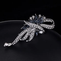 Elegant silver brooch with deep blue marquise gemstone and sparkling crystal ribbons - Silver with Deep Blue Crystal