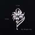 Elegant matte silver flower brooch with grey pearls and crystals on a black background - 3 Pearls
