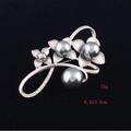 Detail view of flower brooch with grey pearls and crystals on matte silver petals - 3 Flowers