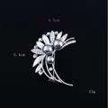 Detailed view of silver flower brooch with dark grey faux pearls and dimensions 4.5cm by 5.4cm - Leaf Melody