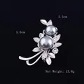 Detail view of flower brooch with gray pearls and crystals, size 3.5cm x 5.6cm - Silk Tree Flower