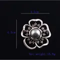 Detailed view of silver flower brooch with dark pearl and crystals measuring 4.5cm - Five-Leaf Melody