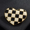 Close-up of heart-shaped brooch with black and white checkered pattern and gold edges - Black and White Checkerboard Heart Style / 1-Heart