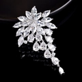 Macro shot of silver flower brooch with pear-cut zirconia and hanging crystal tassels - Grapes