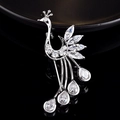 Macro detail of silver peacock brooch inlaid with marquise and teardrop cut crystals - Peacock