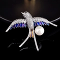 Exquisite swallow brooch with sparkling crystals, purple gradient enamel, and white pearl - Swallow