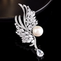 Detail view of silver brooch with marquise zircon leaves and a white pearl drop - Wing