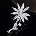 Detailed macro view of a silver floral brooch with marquise-cut marquise zircon crystals - Chrysanthemum
