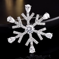 Macro detail of snowflake brooch with silver metal base and clear pear-cut gemstones - Teardrop Snowflake