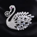 Macro shot of a sparkling swan brooch with cubic zirconia and ruby-colored eye detail - Silver Large Swan Style