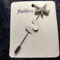Detailed close-up of a silver starfish brooch with sparkling rhinestones on card - Starfish Style (bz9)