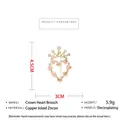 Macro shot of zircon crown heart brooch with pink flowers and gold plating finish - Gold
