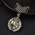 Luxurious medal brooch with black enamel, golden crown shield, and JM letter emblem - Medal Shield Style / 17-Badge