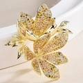 Elegant gold flower brooch with colorful cubic zirconia gradients on white ceramic - Yellow