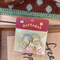 Detailed view of cartoon puppy and bear hair ties in premium retail packaging - Hair Tie / Pink + Blue Puppy