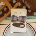 Detail of plaid bow and fabric hair clip set with baby bear tag on display card - Bowknot + Drop Shape