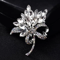 Floral silver-plated alloy brooch featuring white crystal petals and AB rhinestone stem - White Orchid