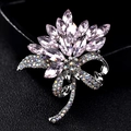 Elegant silver alloy brooch featuring pink marquise crystals and a colorful rhinestone bow - Pink Orchid