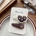 Detail of brown polka dot hair clips with lace trim and buttons on display card - Lace Heart Polka Dot Clips