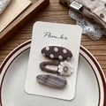 Detailed set of brown polka dot, plaid, and knit daisy hair clips on display card - Coffee Polka Dot Plaid And Daisy Clips