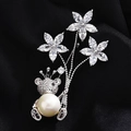 Elegant silver bear brooch featuring a large round white pearl and zircon flowers - Silver Bear