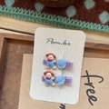 Detail of sweet puppy hair clips with purple velvet base and blue mesh pom-poms - Blue Striped Dog