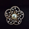 Elegant gold flower brooch with white pearls and sparkling rhinestones on black background - Pearl Plum Blossom