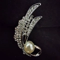 Elegant silver feather brooch with sparkling rhinestones and a large white pearl accent - Silver Leaf