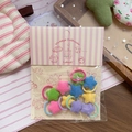 Close-up of colorful plush star hair ties for children in macaron pastel colors - Plush Dopamine Star Style