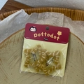 Detail of star-shaped plush hair clips in yellow stripes on decorative display card - Yellow